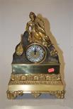 A reproduction gilt brass cased mantel clock