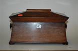 An early Victorian rosewood fitted tea caddy of sarcophagus form