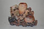 A Chinese carved soapstone spill holder