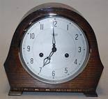 A Smiths Enfield oak cased striking mantel clock