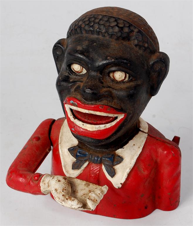 Cast iron reproduction Negro head money bank titled 'Jolly Nigger