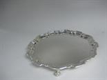 A George V shaped circular Salver engraved monogram on three scroll feet, Sheffield 1926, 12in