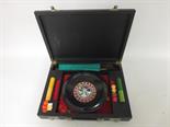 A cased roulette board with chips