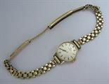 A Lady’s Omega Wristwatch the champagne dial with hourly applied baton markers in 9ct gold case, 9ct