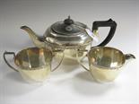 A George V silver three piece Tea Service with simple border decoration, Birmingham 1934