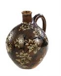 A MARTINWARE GLOBULAR EWERdecorated in sgraffito and painted with flowering plants in bluish white