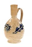 A HIGHLY UNUSUAL DOULTON LAMBETH JUG BY GEORGE TINWORTHthe egg shaped body beneath narrow neck