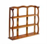 A SET OF ENGLISH WALNUT CHINA SHELVES DESIGNED BY ERNEST GIMSONof two bow ended shelves and with