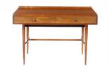 AN ARCHIE SHINE LTD ROSEWOOD WRITING TABLE DESIGNED BY ROBERT HERITAGEthe rectangular top fitted