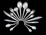 A GEORG JENSEN SILVER TABLE SERVICE FOR EIGHTCaraval pattern, designed by Henning Koppel in 1957,
