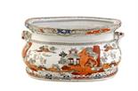 A STAFFORDSHIRE STONE CHINA FOOTBATHof bombé form with shell handles, transfer printed in sepia
