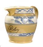 A DATED EARTHENWARE JUGdipped in drab slip and with incised decoration, the inscription Wm Riley