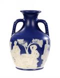 A STAFFORDSHIRE BRIGHT BLUE STONEWARE REPLICA OF THE PORTLAND VASEornamented in white stoneware, the