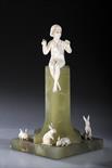 FERDINAND PREISSGIRL WITH RABBITScarved ivory on onyx base, 13.5cm h, engraved signature F Priess,