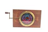 A Chromatrope Magic Lantern Slide, mahogany and brass bound, screws replaced, spins intermittently