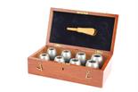 A set of eight Aluminium Egg Grading Machine Test Poises, in mahogany case with brass label `Egg