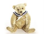 An early Steiff centre-seam Teddy Bear, circa 1905, with blonde mohair, black boot button eyes,