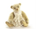 A Steiff white mohair Teddy Bear, circa 1906, with black boot button eyes, pronounced clipped