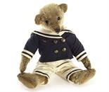 A J.K. Farnell Teddy Bear, circa 1912, with blonde mohair, black boot button eyes, pronounced