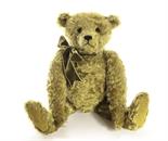 A Stier Bears `Lincoln` by Kathleen Wallace, No. 6 of 8 with label signed by artist, moss green