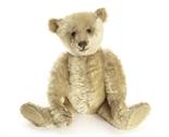 A Steiff Teddy Bear, circa 1908, with blonde mohair, black boot button eyes, pronounced clipped