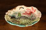 A Japanese Meiji Plate moulded & painted with insects and water-lilies 7½ ins (19 cms) in width.