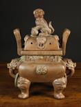 A Moulded Terracotta Yixing Koro of bulbous rectangular form, having seal mark to base.  The