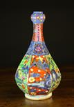 An Oriental Hexagonal Vase decorated in vibrant polychrome enamels and measuring 11 ins (28 cms)