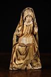 A Fine 15th Century Carving of Saint Anne sat with a book on her lap.  Wearing a wimple with