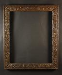 A 17th Century Carved Oak Frame enriched with scrolling foliage, 37¼ ins x 32 ins (94.5 cms x 81