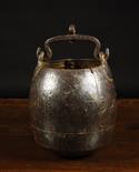 An Unusual 17th/18th Century Iron Pot of ovoid form composed of riveted sheets and having a swing