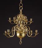 A 19th Century Flemish Brass Twelve Branch Chandelier.  The crested S-scroll branches set in two