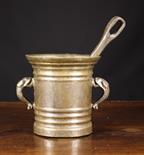 A Large Early 18th Century Bronze Pestle & Mortar.  The ring turned mortar with dolphin handles 8