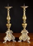 A Pair of 18th Century Flemish Bronze Pricket Sticks.  The knopped stems above triform bases on