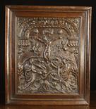 An Early 17th Century Oak Panel carved in relief; 'The Crucifixion of Christ', in a moulded frame