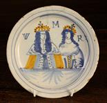 A Late 17th Century London Delft Plate, painted in shaded blue and yellow glaze with double portrait