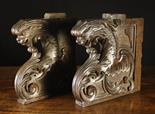 A Pair of Good Early 16th Century Walnut Choir Stall Fragments carved as zoomorphic creatures