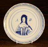 An Early 18th Century Queen Anne Blue & White Delft Plate.  The centre panel painted with portrait