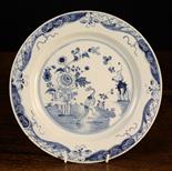 A Fine 18th Century English Blue & White Delft Plate.  The centre panel decorated with an exotic