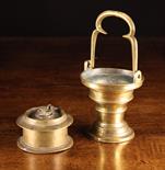 A 17th Century Brass Bénitier and a 16th Century Bronze Inkwell. The Bénitier having trefoil swing