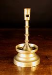 A Rare Flemish Brass Candlestick, Circa 1500-1525. The ring turned socket with lateral cut