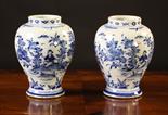 A Pair of Blue & White Delft Vases decorated with sprays of flowers and butterflies, 7 ins (18