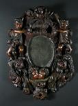 A Delightful Late 17th/Early 18th Century Carved & Polychromed Wall Mirror.  The oval glass plate in