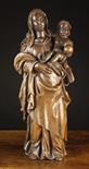 A 16th Century Oak Figure Group: The Virgin & Child carved in high relief with a hollowed back,