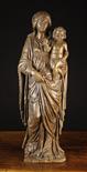 An Early 16th Century Oak Carving of Virgin & Child, Circa 1500, carved in high relief: The Virgin