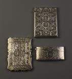 Three Fine Engraved Silver Card Cases: Two Victorian cases decorated with scrolling foliate designs;