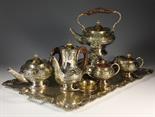 A Large Sheffield Plated Tray and a Sheffield Plated Tea-service embossed and chased with