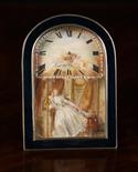 A Small French Table Clock in a black enamelled and silver arch-topped frame. The dial painted