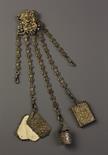 A Decorative 19th Century Chatelaine hung with five chains suspending three intricately cast