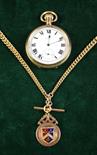 An American Gold Plated Pocket Watch on a 9 Carat Gold Chain with fob (approx 36 grams).